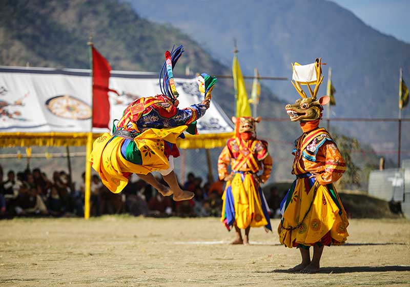 Masked dancer jumping